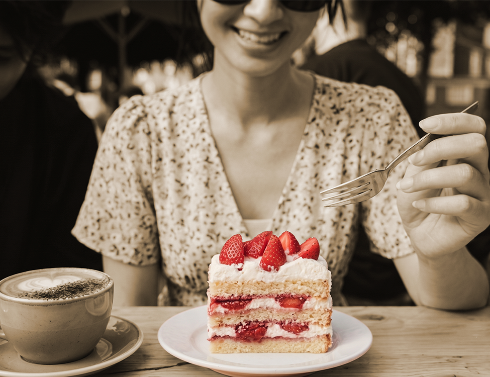 Image of woman eating cake